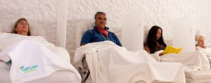 Four clients relaxing as they breath easy during a salt session.